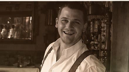 A young Paul in a professional kitchen, in sepia