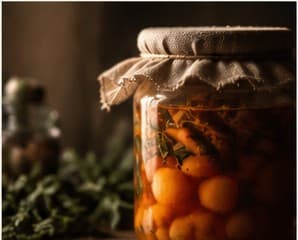 A cloth-topped jar of fermenting vegetables