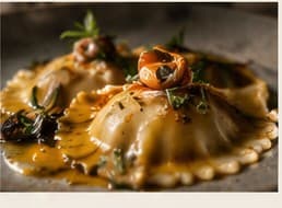 A single large raviolo in bisque with chives