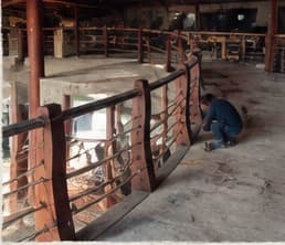 The curved balustrade being fitted along the mezzanine