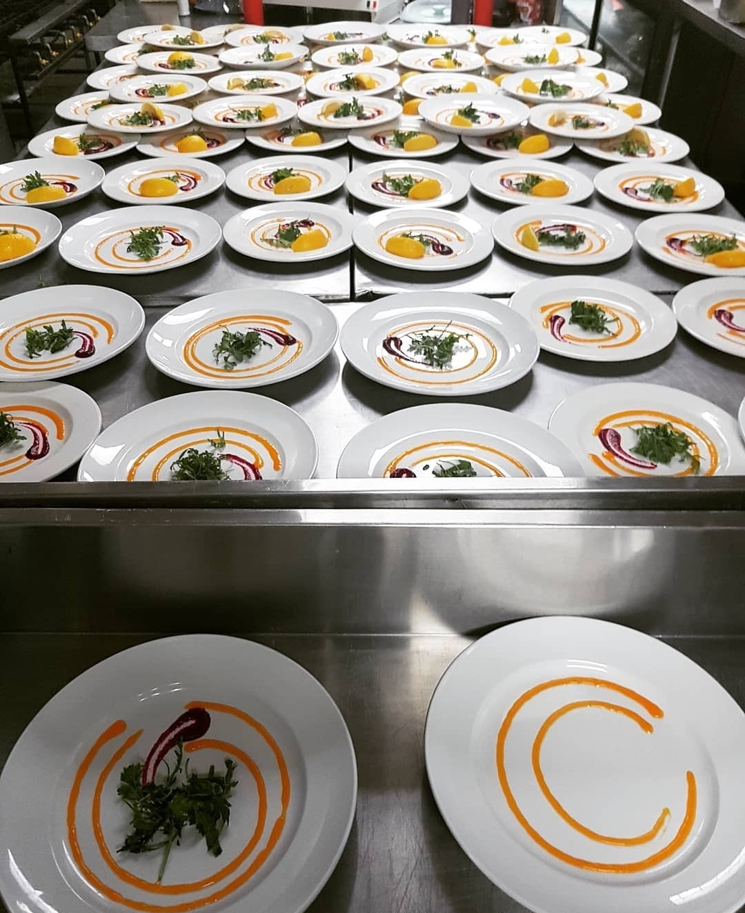 A long restaurant pass filled with prepared plates